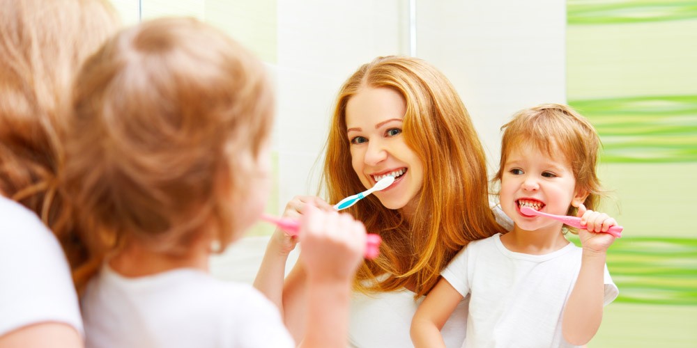 parents and children brushing