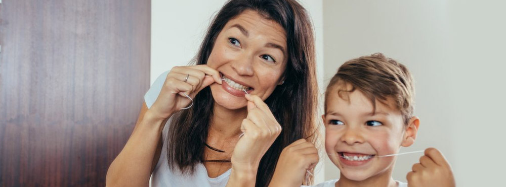 parent and child flossing