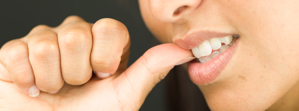 woman biting nails